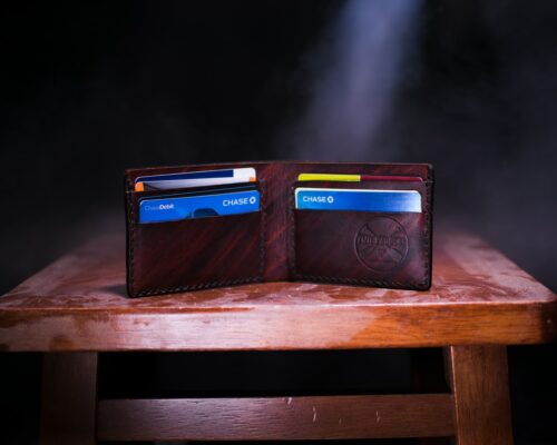 brown leather bifold wallet on table